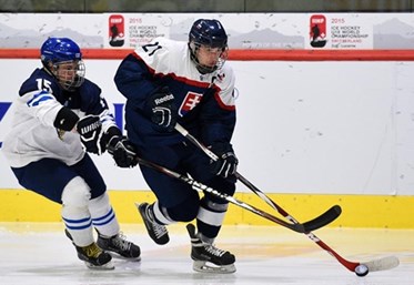 LUCERNE, SWITZERLAND - APRIL 23: Slovakia's Peter Valent #21 skates with the puck while Finland's Petrus Palmu #15 chases him down during quarterfinal round action at the 2015 IIHF Ice Hockey U18 World Championship. (Photo by Matt Zambonin/HHOF-IIHF Images)

